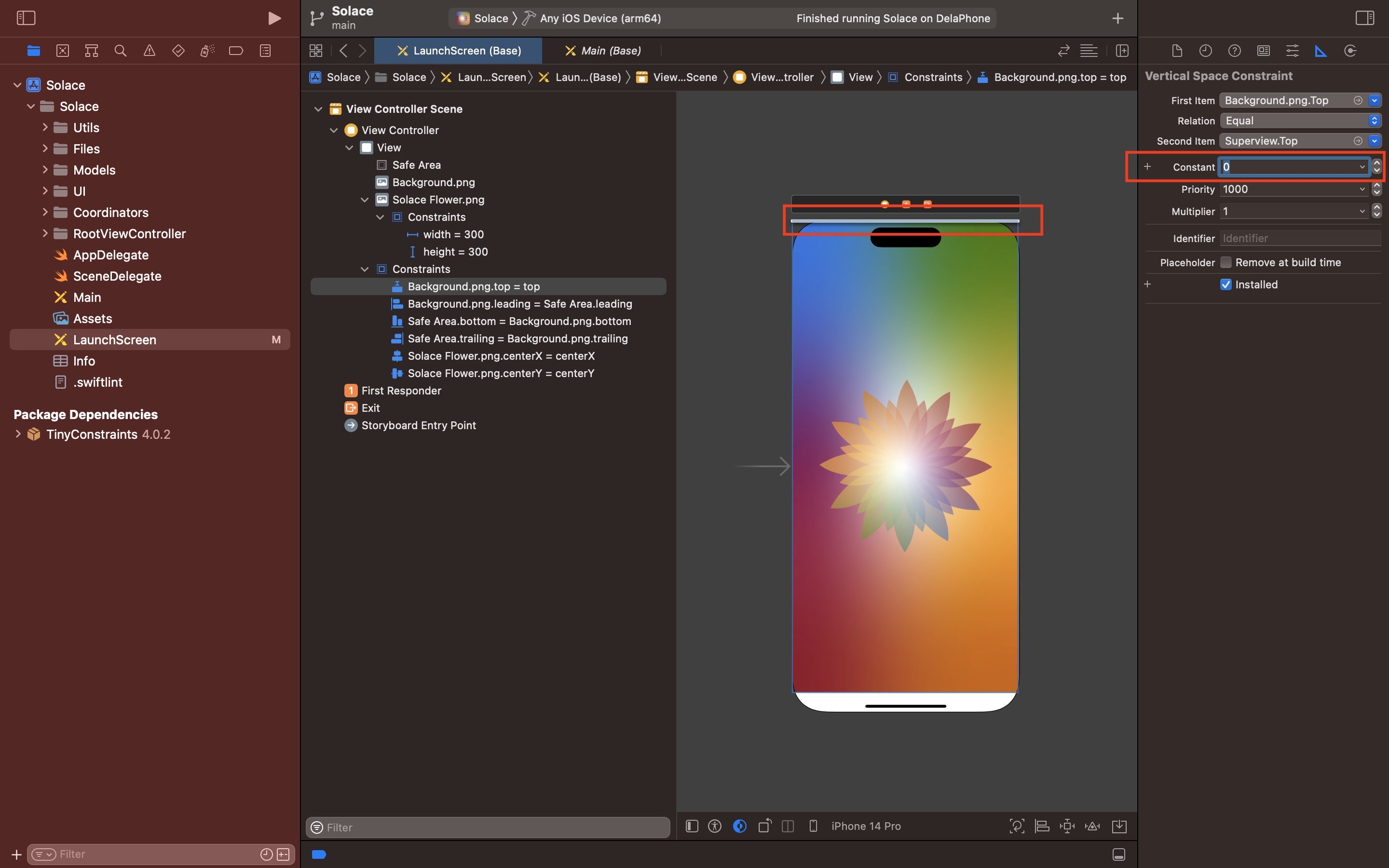 A screenshot of Xcode showing the launch screen storyboard. One of the constraints in the storyboard inspector is selected. On the right menu side bar the size inspector is selected and we have highlighted how we have set the constant to 0. After changing from Safe Area to Superview, this constant will reflect the value of the safe area inset for that constraint, which will not be 0. To make sure that the constraint touches the edge, set it to 0.