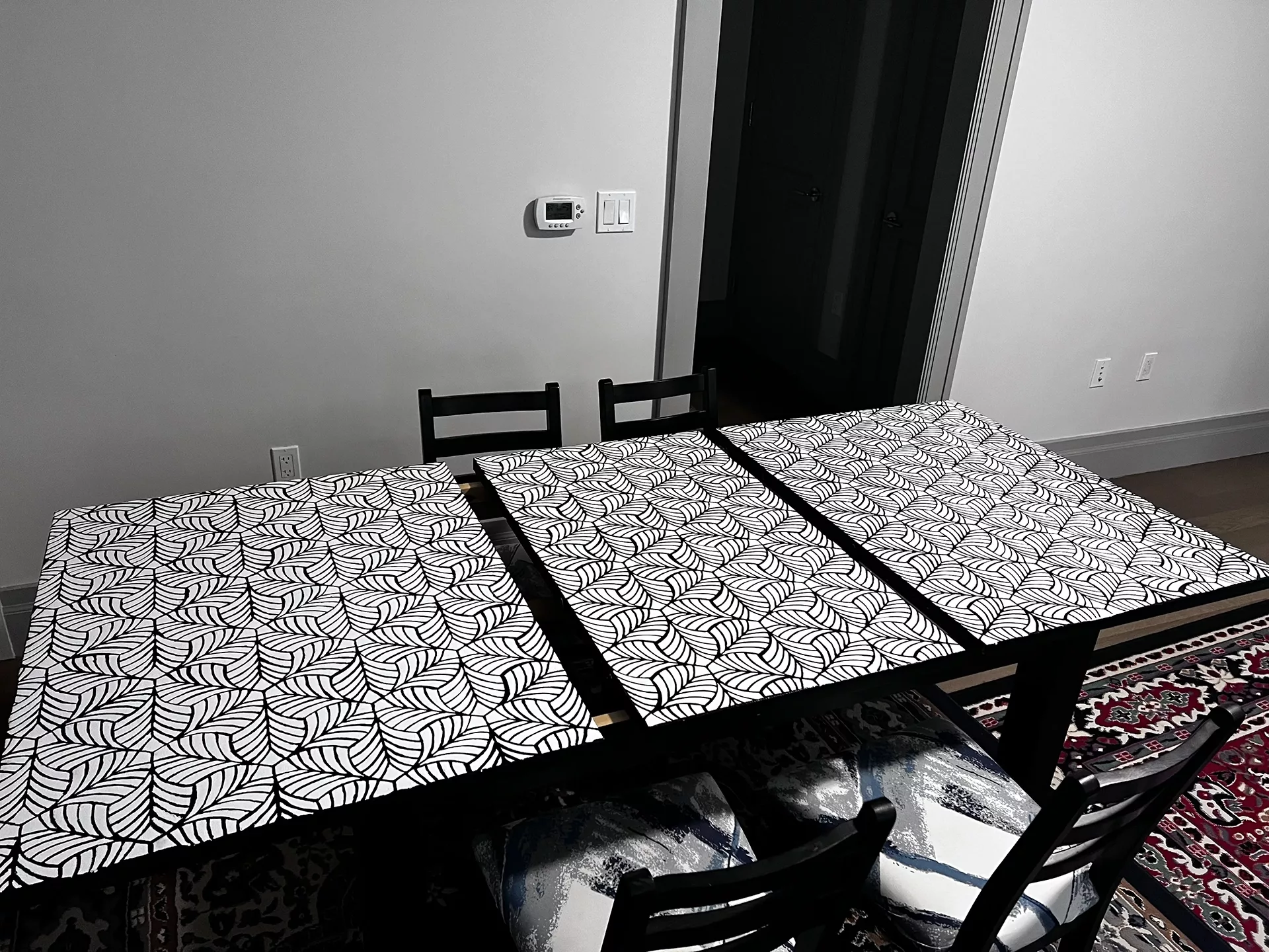 The table opened up to show the three pieces.