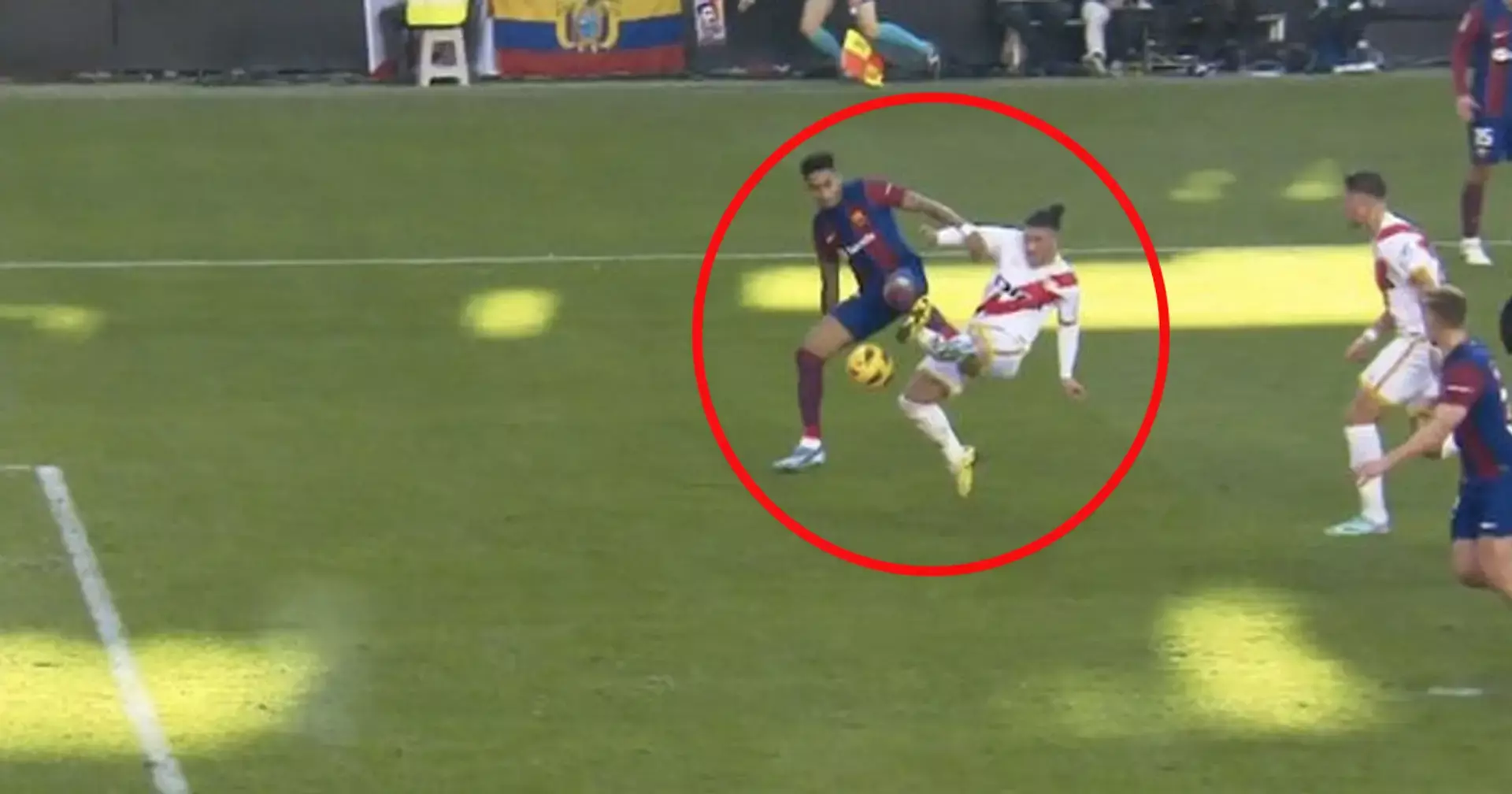 A moment of contact during Barcelona vs Rayo Vallencano in LaLiga (Spanish Division One) in 2023. There is contact between a Pacha Espino and Raphinha but it occurs after Raphinha touches the ball and therefore it is not a penalty.